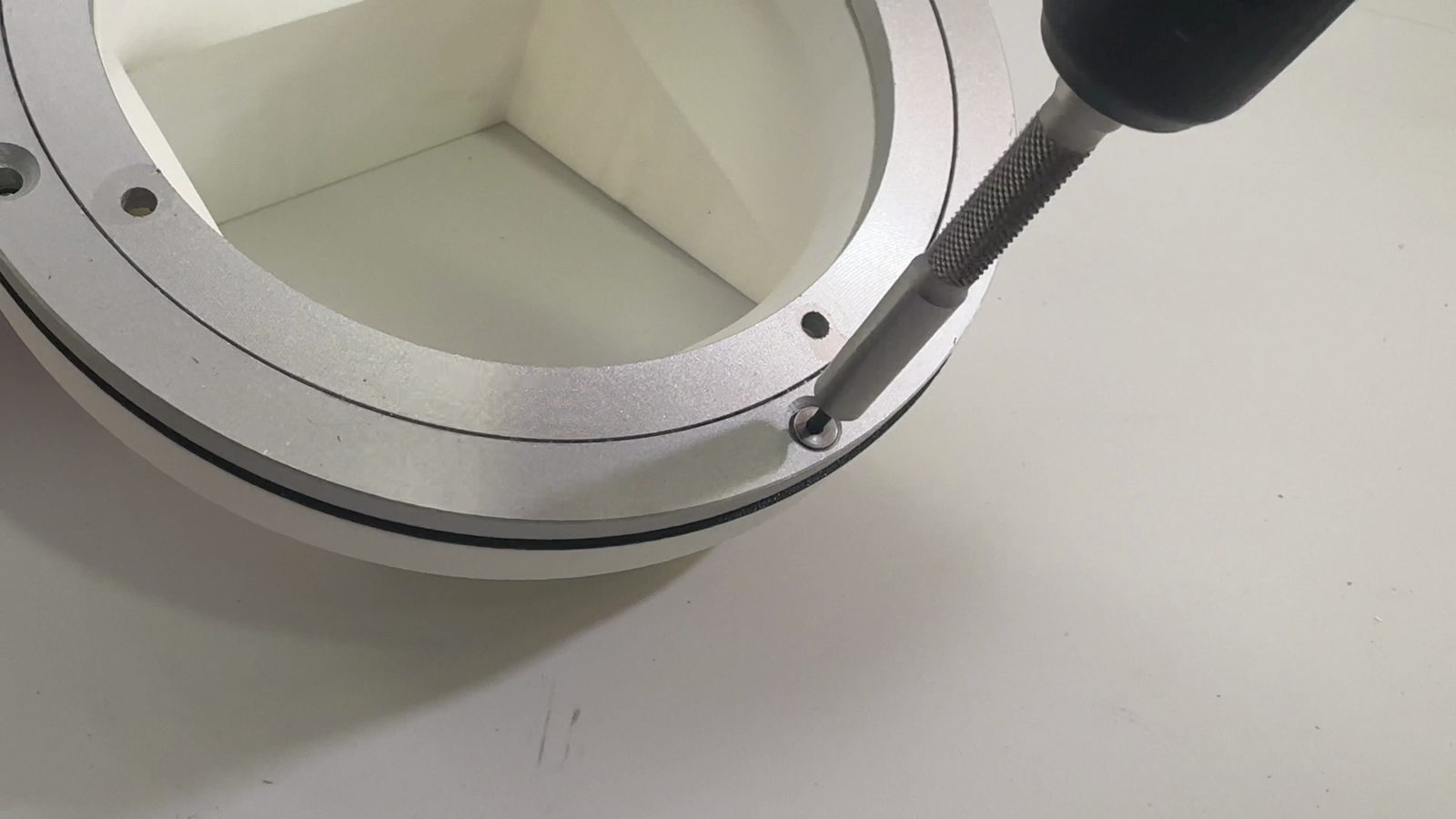 Driving the screw into the chute mount