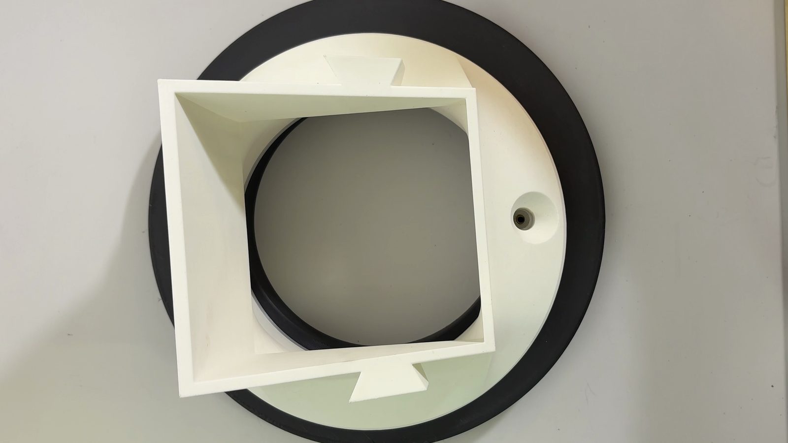 Pass-through hole lined up over the next heat insert after rotating