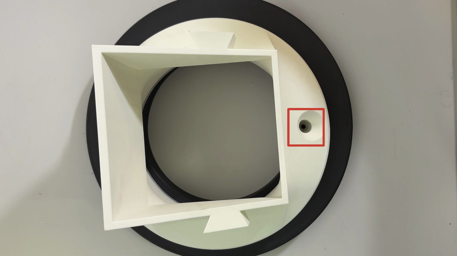 Pass-through hole lined up over the heat insert, marked with a red square