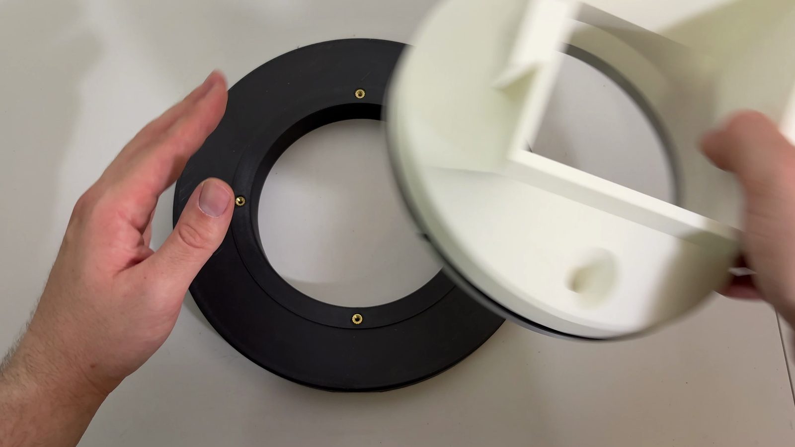Placing the chute mount and Lazy Susan assembly onto the bottom static part